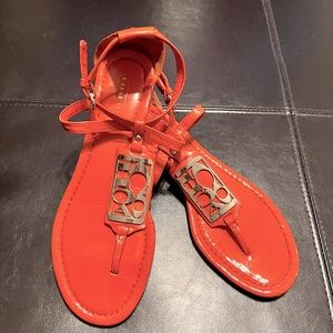 Coach Odele Silver Sandals. Great condition. 8.5M, gold hardware, salmon color.
